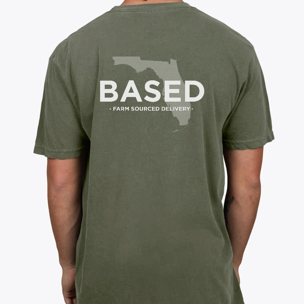 Green t-shirt with 'BASED' and Florida outline on the back, worn by a person.